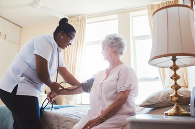 Healthcare Providing Help To An Elderly Individual