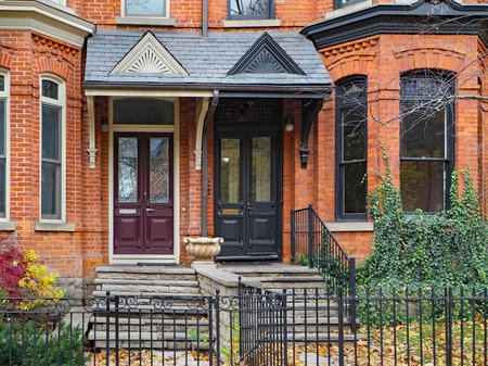 brick duplex behind iron gates