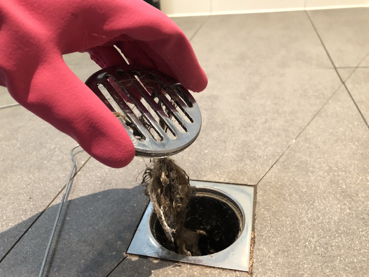 cleaning hair from bathroom sink drains