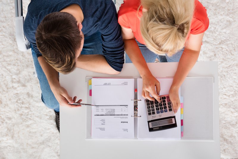 couple with calculator