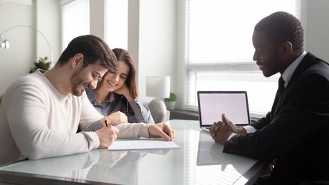 couple signing loan