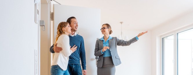 couple touring house with an agent