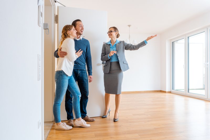 couple touring a house with an agent