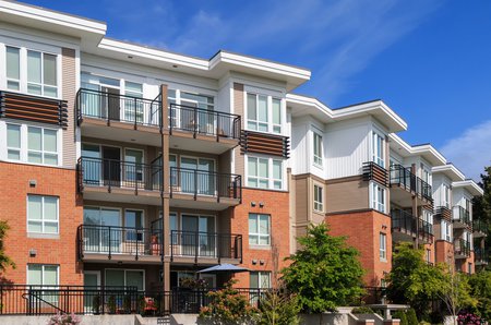 residential condominiums with blue skies