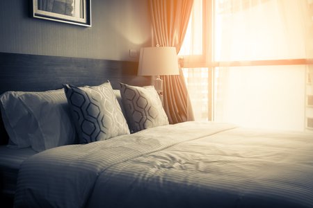hotel bed sunlight