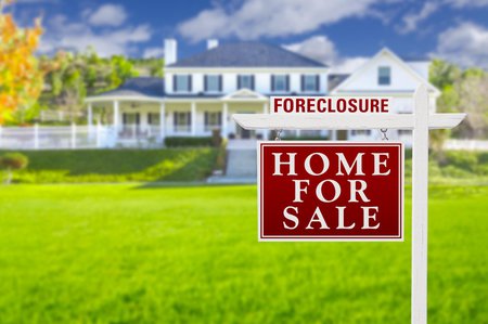 Foreclosure sign in front of house