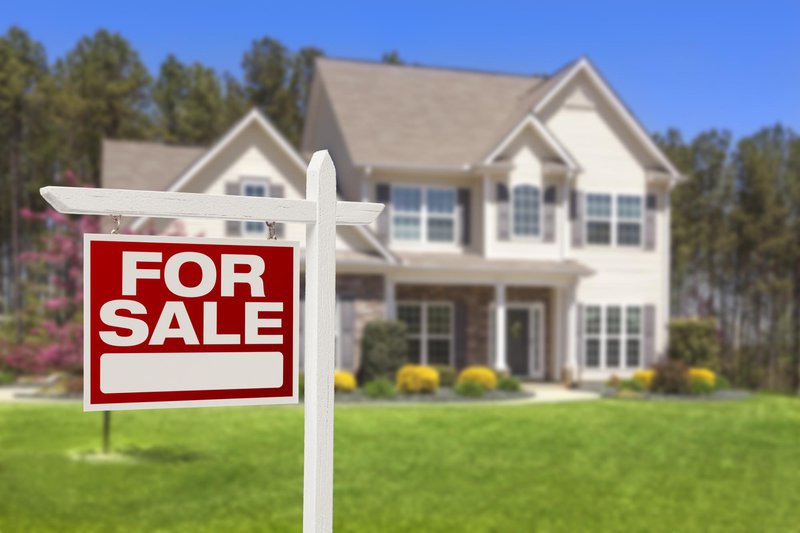 Home with For Sale sign
