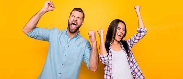 Happy couple against yellow background