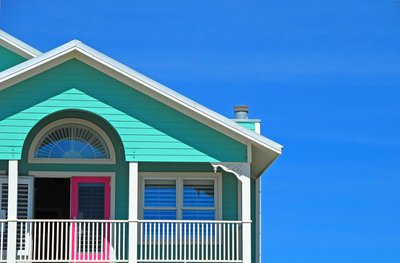 Turquoise house against a blue sky