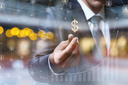 Businessman with dollar sign on blurred background