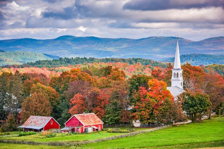 Small town with church steeple and farm