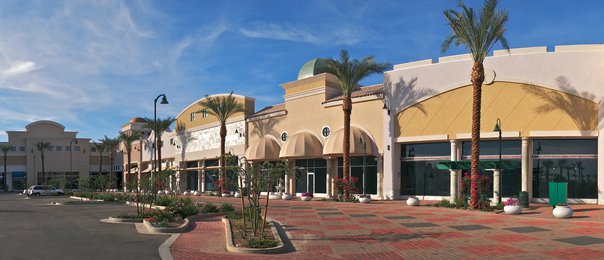 New outdoor shopping mall with palms.