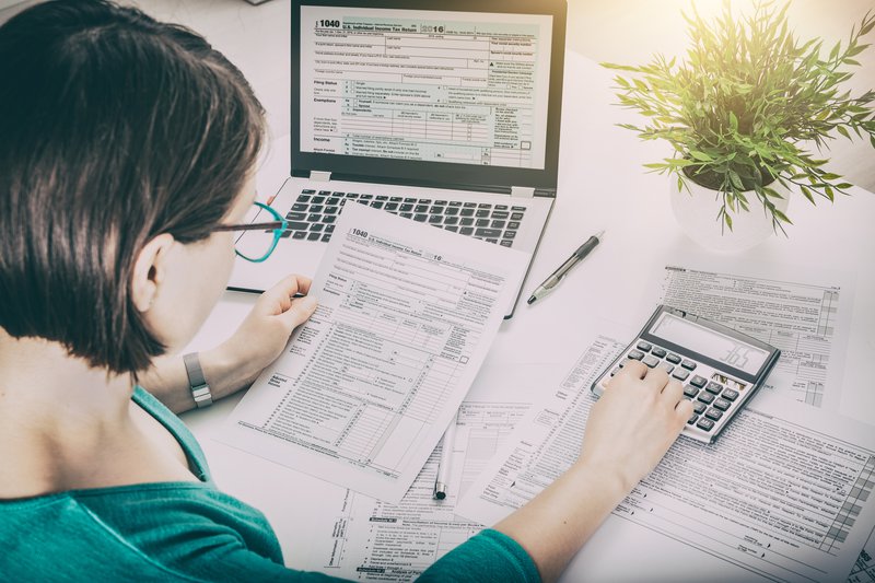 woman calculating taxes