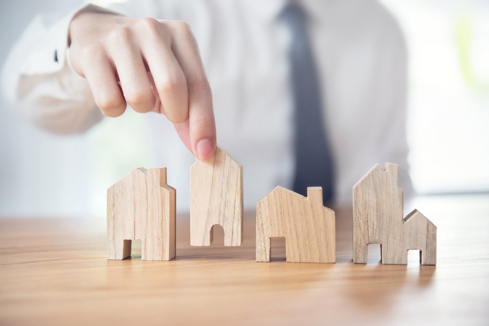 hand moving wooden house models