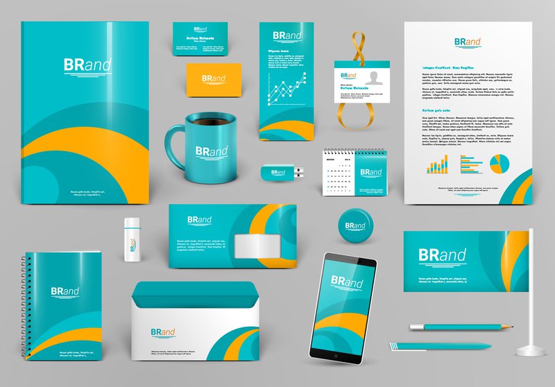 Image showing different marketing and business materials, including business cards and merchandise, all with the same colors, patterns, fonts and overall branding.